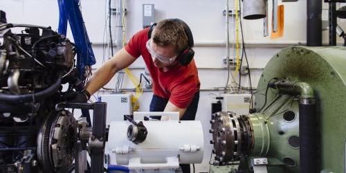 A student works on an engine